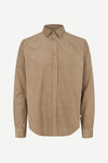 A tan long-sleeve button-down shirt with a classic collar, displayed on a clean, light gray background.