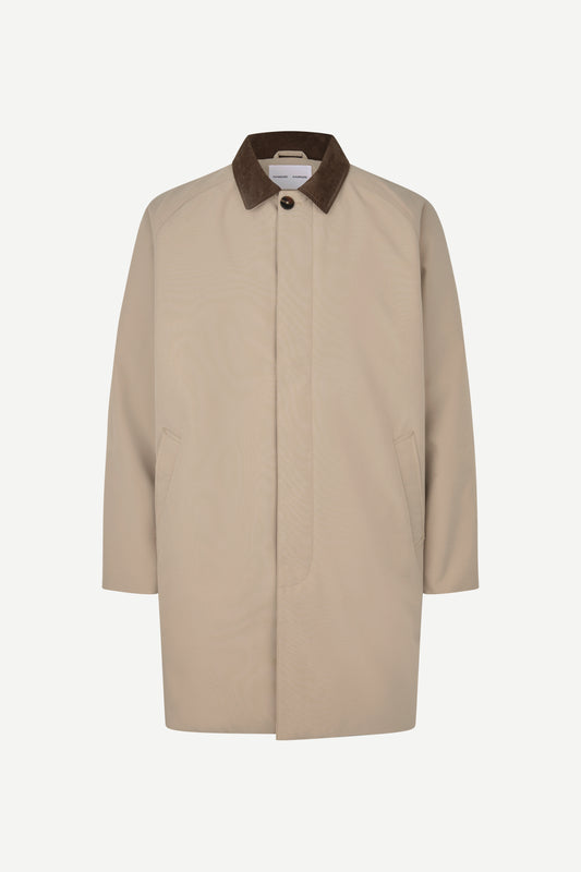 A beige trench coat with a contrasting dark brown corduroy collar, shown against a plain light gray background.