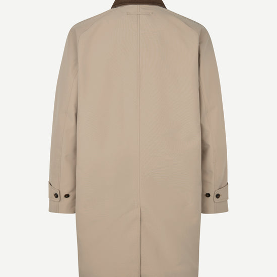 A beige trench coat shown from the back, featuring a dark brown collar and button details on the cuffs, set against a plain light gray background.