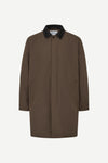 A brown longline utility coat with a contrasting black collar, displayed on a clean white background.