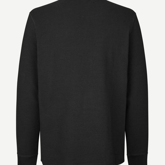 A black long-sleeve crewneck sweatshirt shown from the back, displayed on a clean, light gray background.