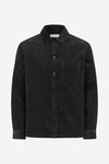 A black long-sleeve button-up shirt jacket with a chest pocket, shown on a clean white background.