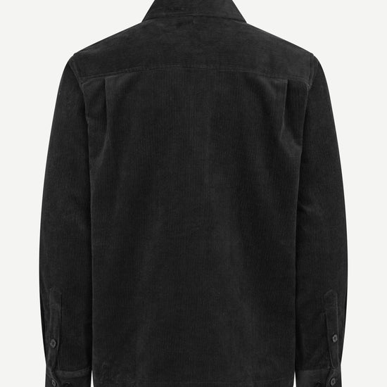 A black corduroy jacket shown from the back, featuring a classic collar and long sleeves with button cuffs, displayed on a clean white background.