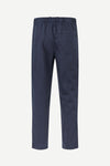 A pair of navy blue trousers shown from the back, featuring an elastic waistband and a single back pocket, displayed on a clean white background.