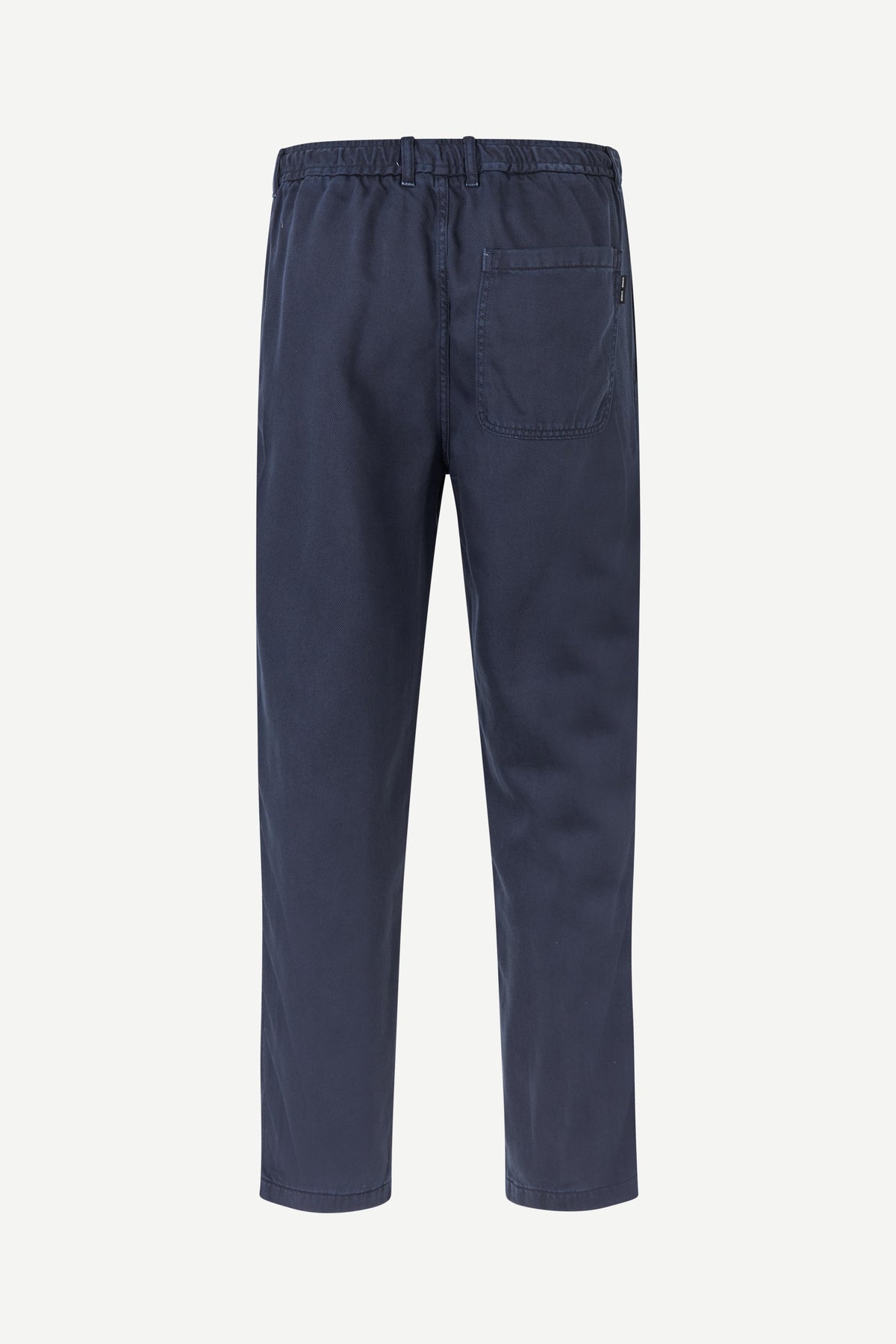 A pair of navy blue trousers shown from the back, featuring an elastic waistband and a single back pocket, displayed on a clean white background.