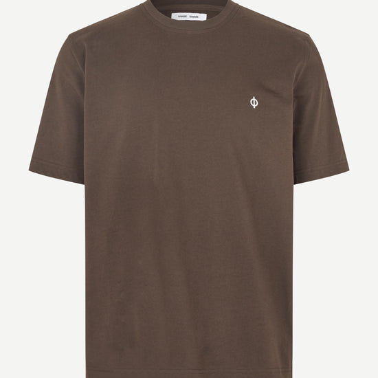A brown short-sleeve crewneck t-shirt with a small white embroidered logo on the left chest, displayed on a clean off-white background.