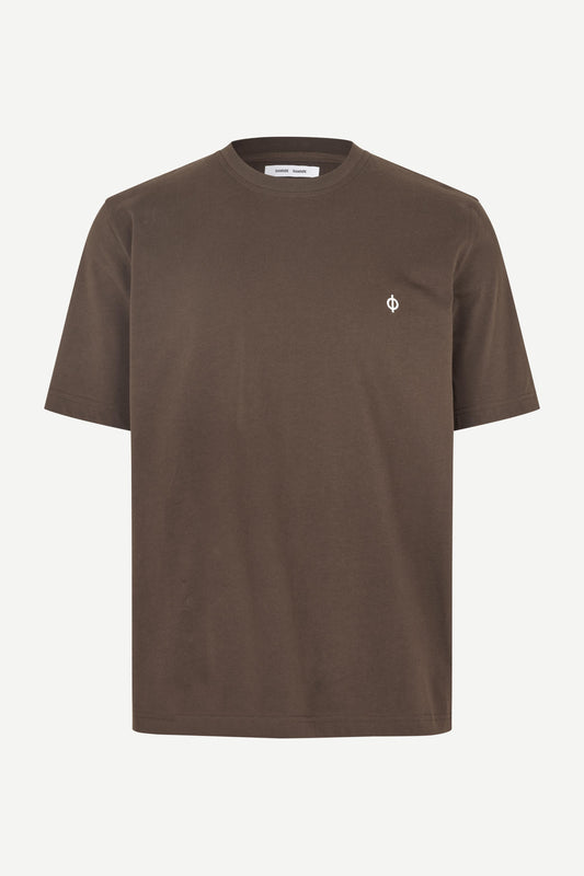 A brown short-sleeve crewneck t-shirt with a small white embroidered logo on the left chest, displayed on a clean off-white background.