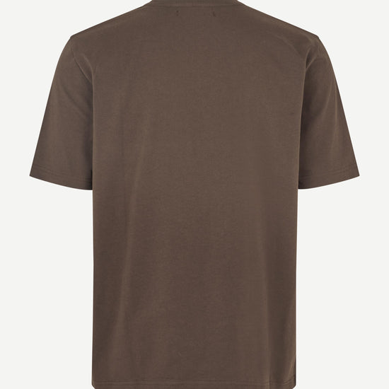 A plain brown short-sleeve crewneck t-shirt shown from the back, displayed on a clean off-white background.