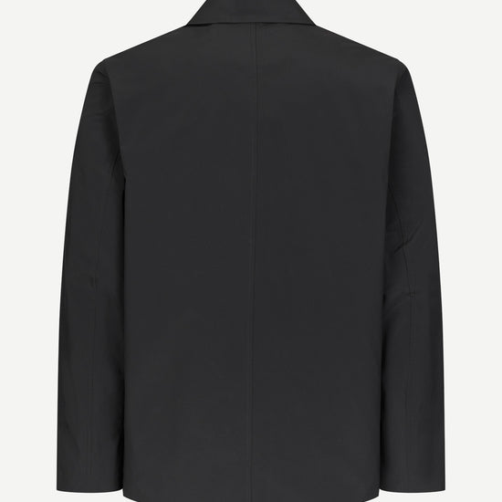 A black long-sleeve blazer shown from the back, photographed against a clean, light off-white background.