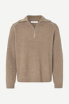 A beige ribbed knit half-zip sweater with a mock neck collar, displayed on a clean white background.