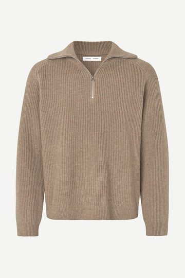 A beige ribbed knit half-zip sweater with a mock neck collar, displayed on a clean white background.