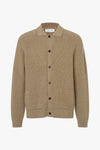 A beige ribbed knit cardigan sweater with a collar, dark buttons, and two front patch pockets, shown on a plain white background.