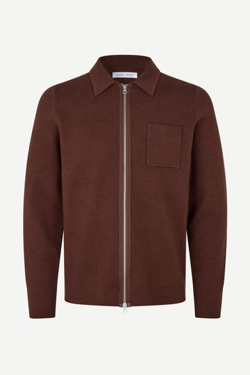 A brown zip-up knit polo shirt jacket with a chest pocket, displayed on a clean white background.