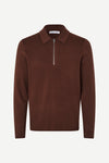 A dark brown long-sleeve knit polo sweater with a half-zip collar, displayed on a clean white background.