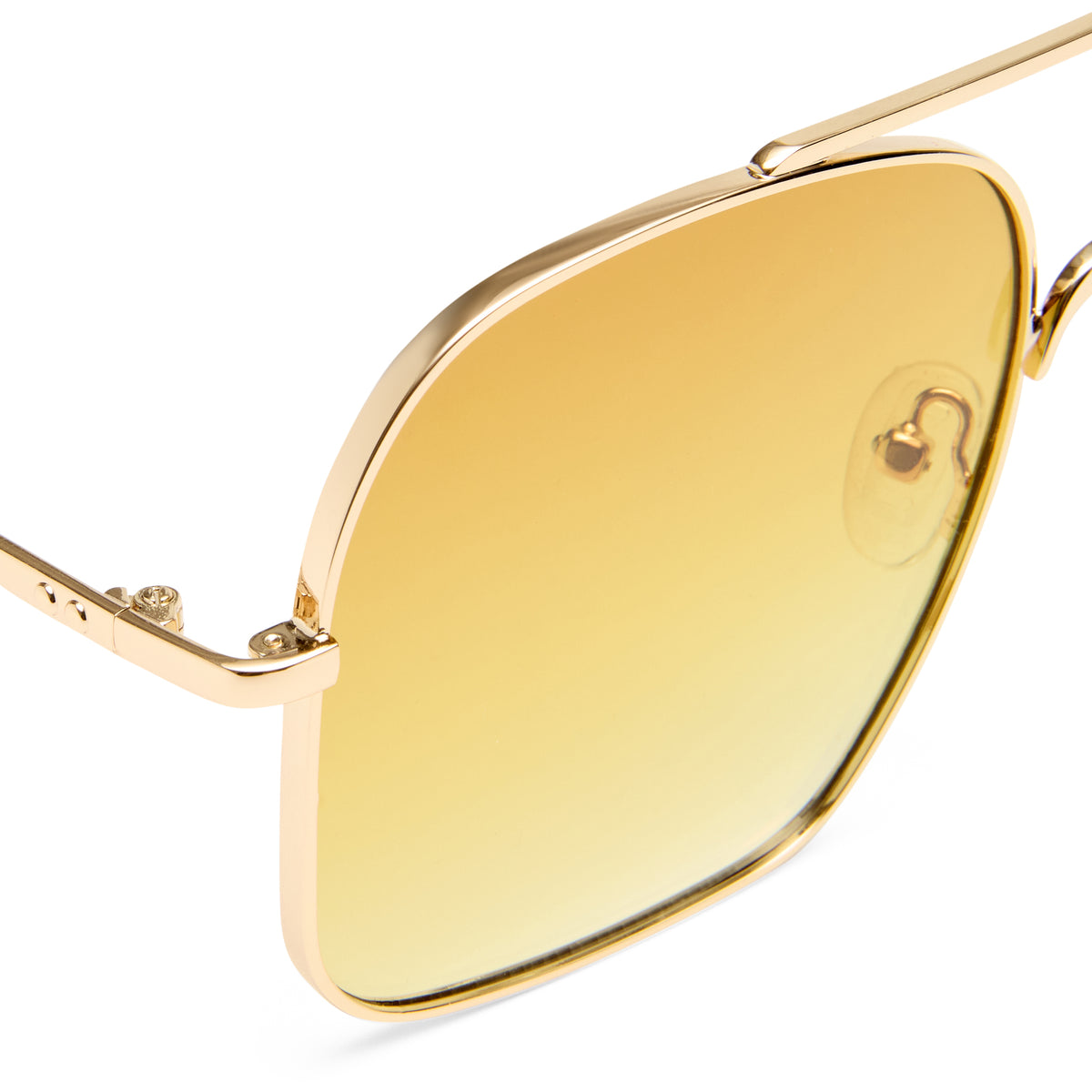 Gold-framed sunglasses with yellow-tinted lenses on a white background