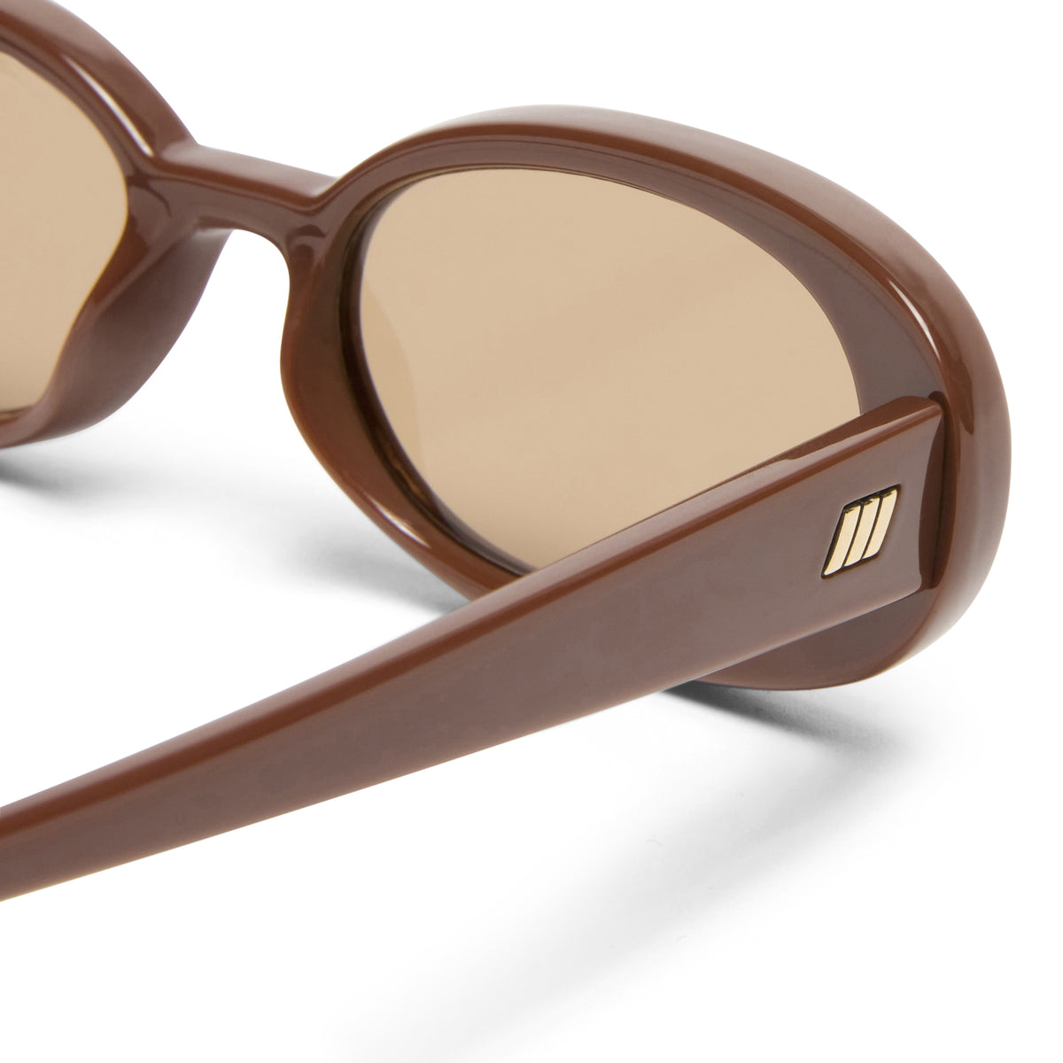 Brown sunglasses with a visible brand logo on a white background