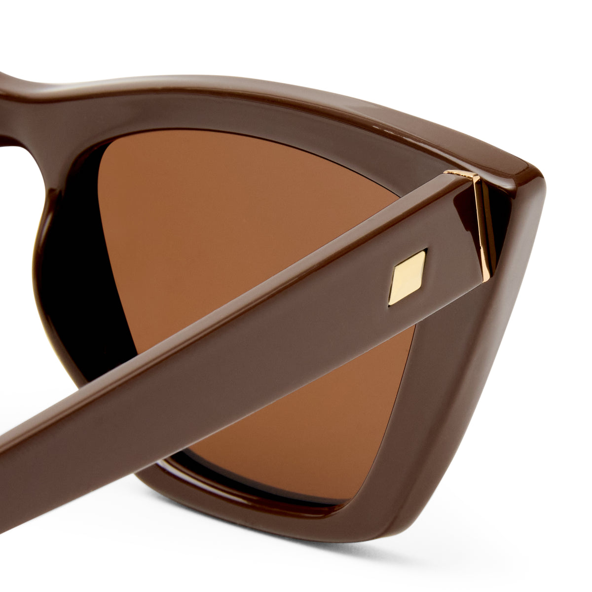 Brown sunglasses with a gold accent on a white background