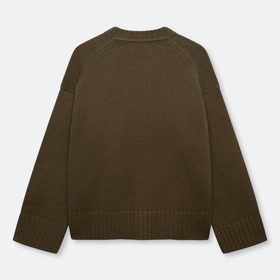 A dark brown ribbed knit sweater shown from the back, laid flat against a light gray background.