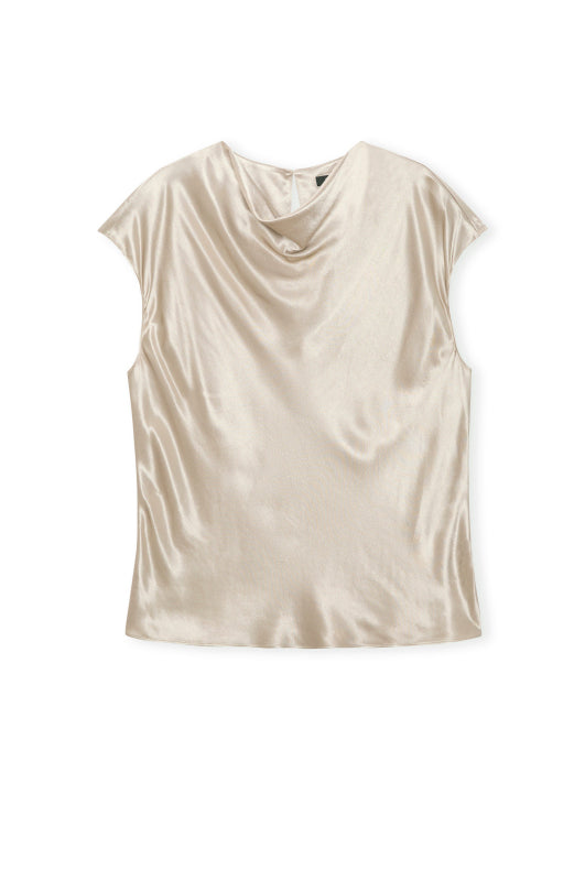 Cream silk top on white background