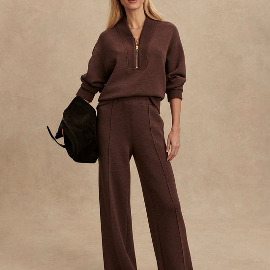 chocolate brown half zip jumper with dropped shoulder, rib detailing and gold zip model shot