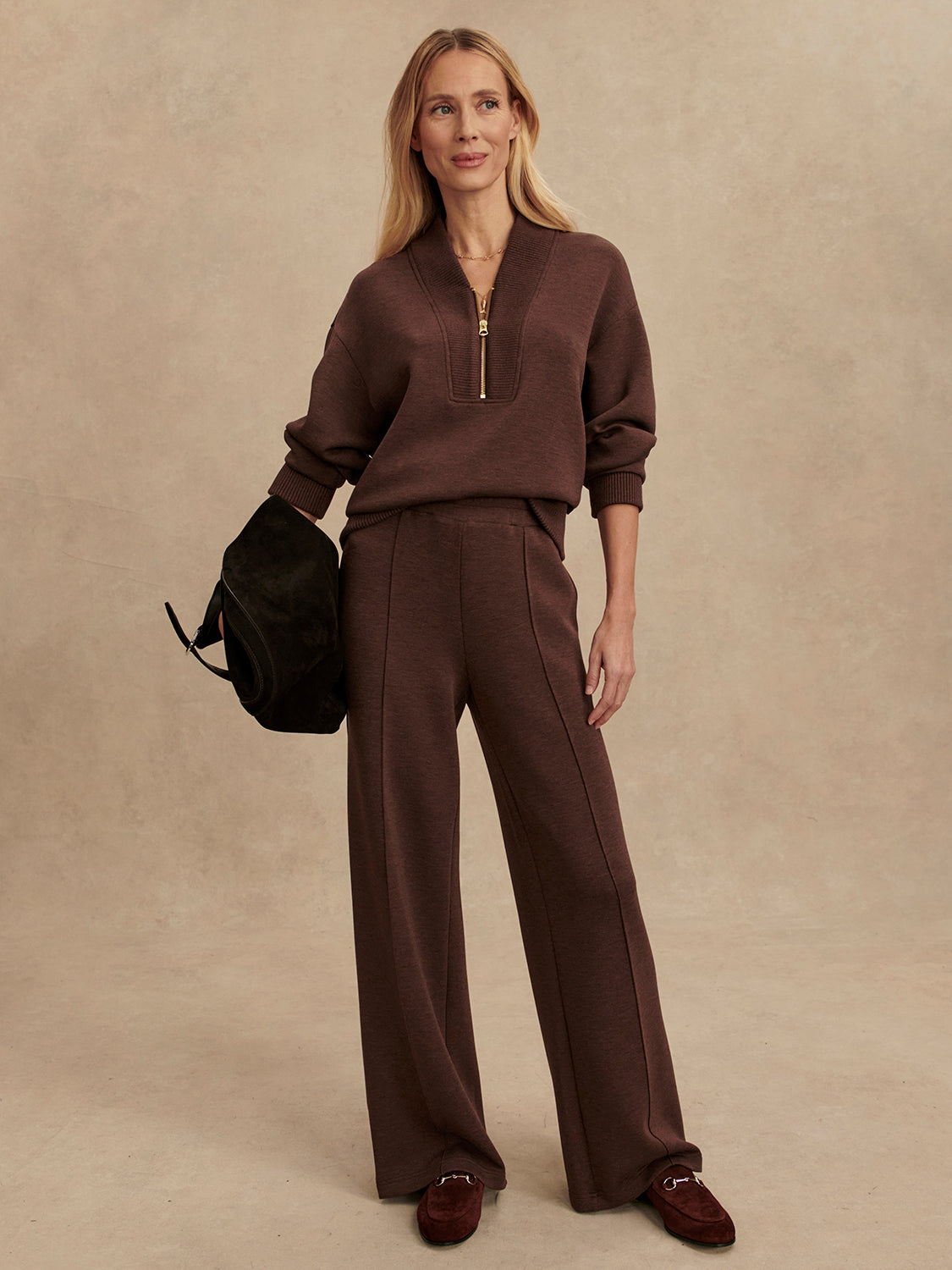 chocolate brown half zip jumper with dropped shoulder, rib detailing and gold zip model shot