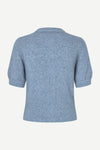 A light blue short-sleeve knit top shown from the back, featuring a ribbed hem and cuffs, on a plain off-white background.