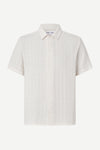 White checkered short-sleeve shirt on a white background