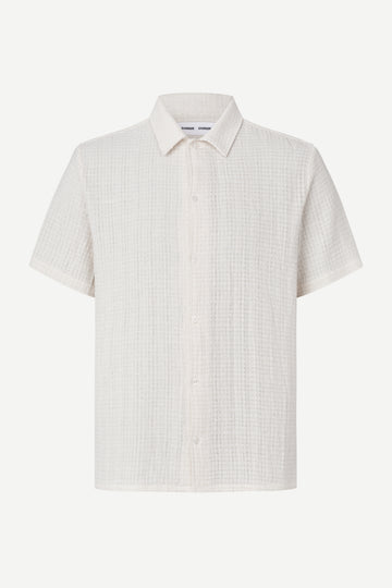 White checkered short-sleeve shirt on a white background