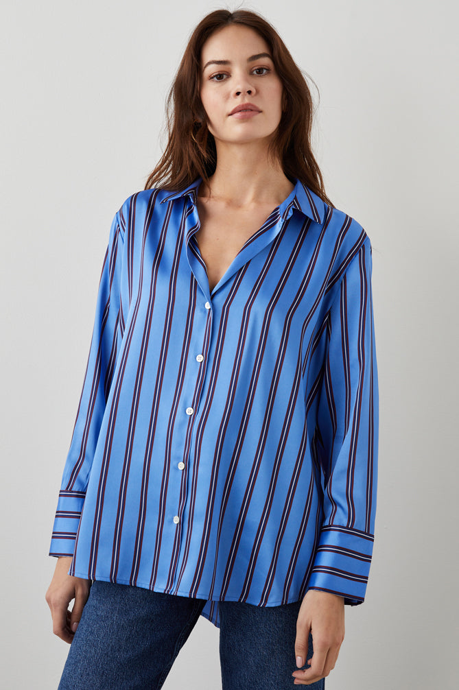 Blue satin shirt with long sleeves and button fastening with a vertical burgundy navy and white stripe