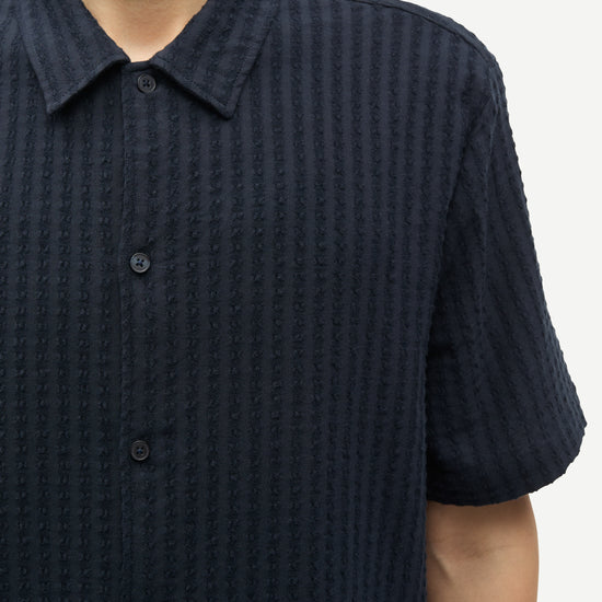 Close up of navy cotton stretch shirt