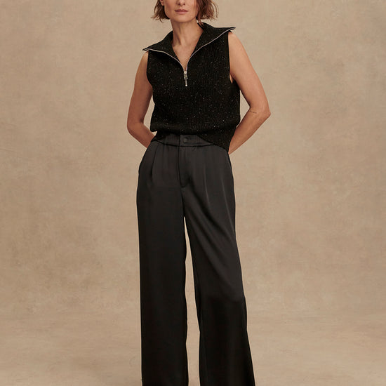 wide leg black viscose trousers with pleated front and side pockets model shot
