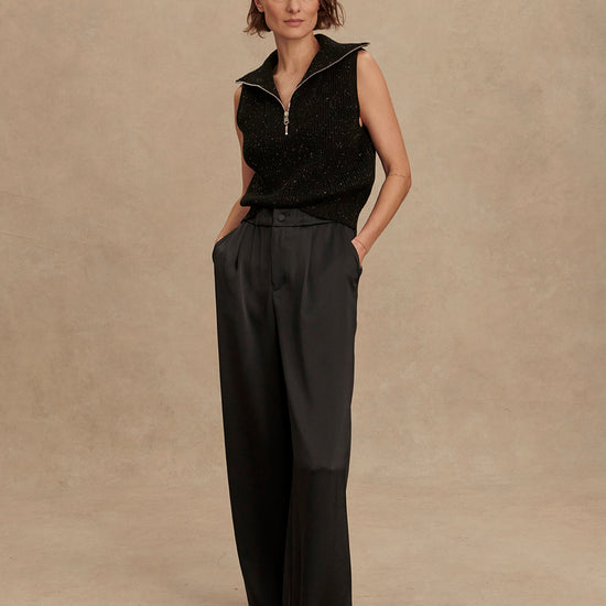wide leg black viscose trousers with pleated front and side pockets model shot