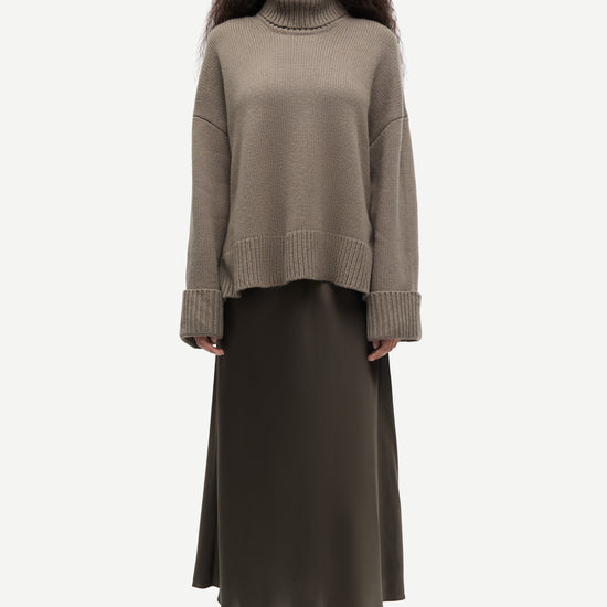 khaki green chunky roll neck jumper with ribbed neck, cuffs and hemline from samsoe samsoe model shot