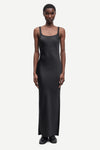 black slip dress with wide straps and figure hugging fit from samsoe samsoe model shot