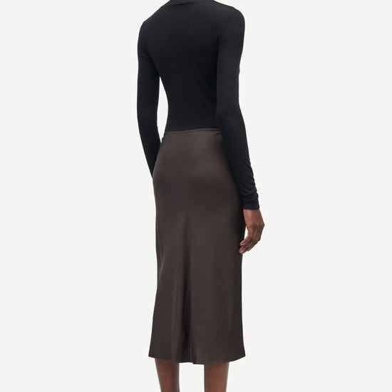 Short mid length satin slip skirt in chocolate brown from samsoe samsoe rear view