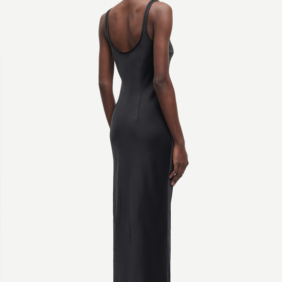black slip dress with wide straps and figure hugging fit from samsoe samsoe rear view