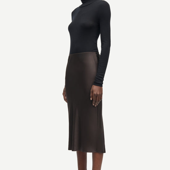 Short mid length satin slip skirt in chocolate brown from samsoe samsoe side view