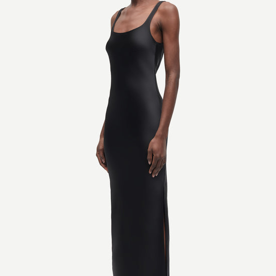 black slip dress with wide straps and figure hugging fit from samsoe samsoe side view