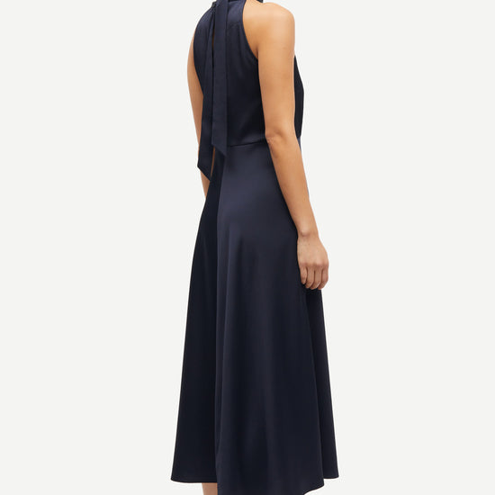 navy blue halterneck dress with open back and tie detail from samsoe samsoe rear view