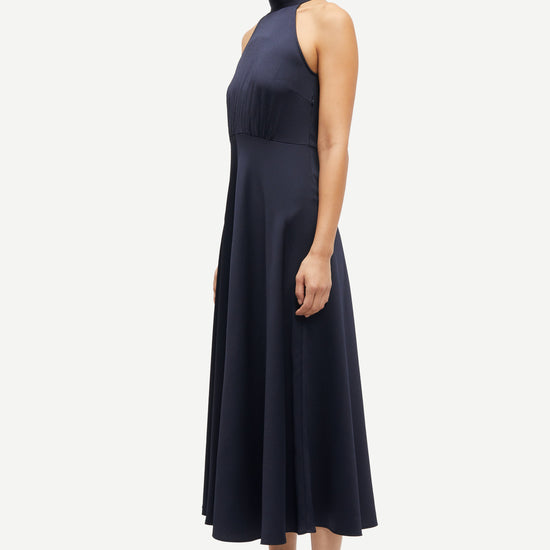 navy blue halterneck dress with open back and tie detail from samsoe samsoe side view