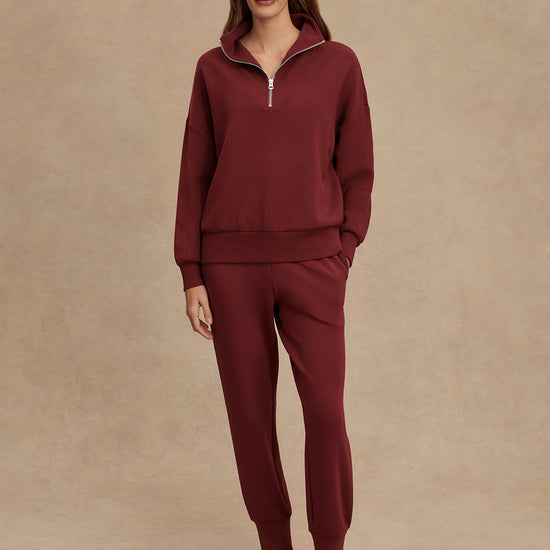 maroon high neck quarter zip jumper with zip detailing and relaxed fit model shot