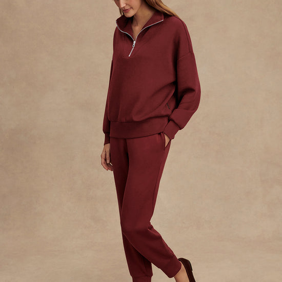 maroon high neck quarter zip jumper with zip detailing and relaxed fit model shot