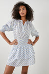 White and ditsy print dress with elbow length raglan sleeves ruched waist half placket with button fastening and crew neck with double layered short skirt