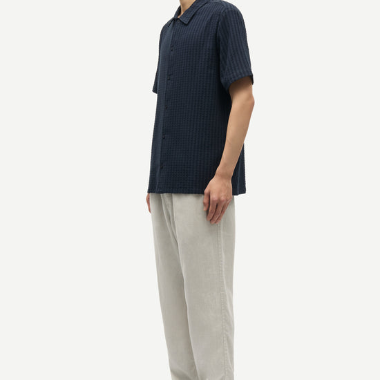 Side view of navy stretch cotton short sleeve shirt