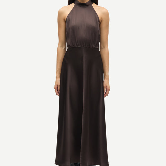 navy blue halterneck dress with open back and tie detail from samsoe samsoe model shot