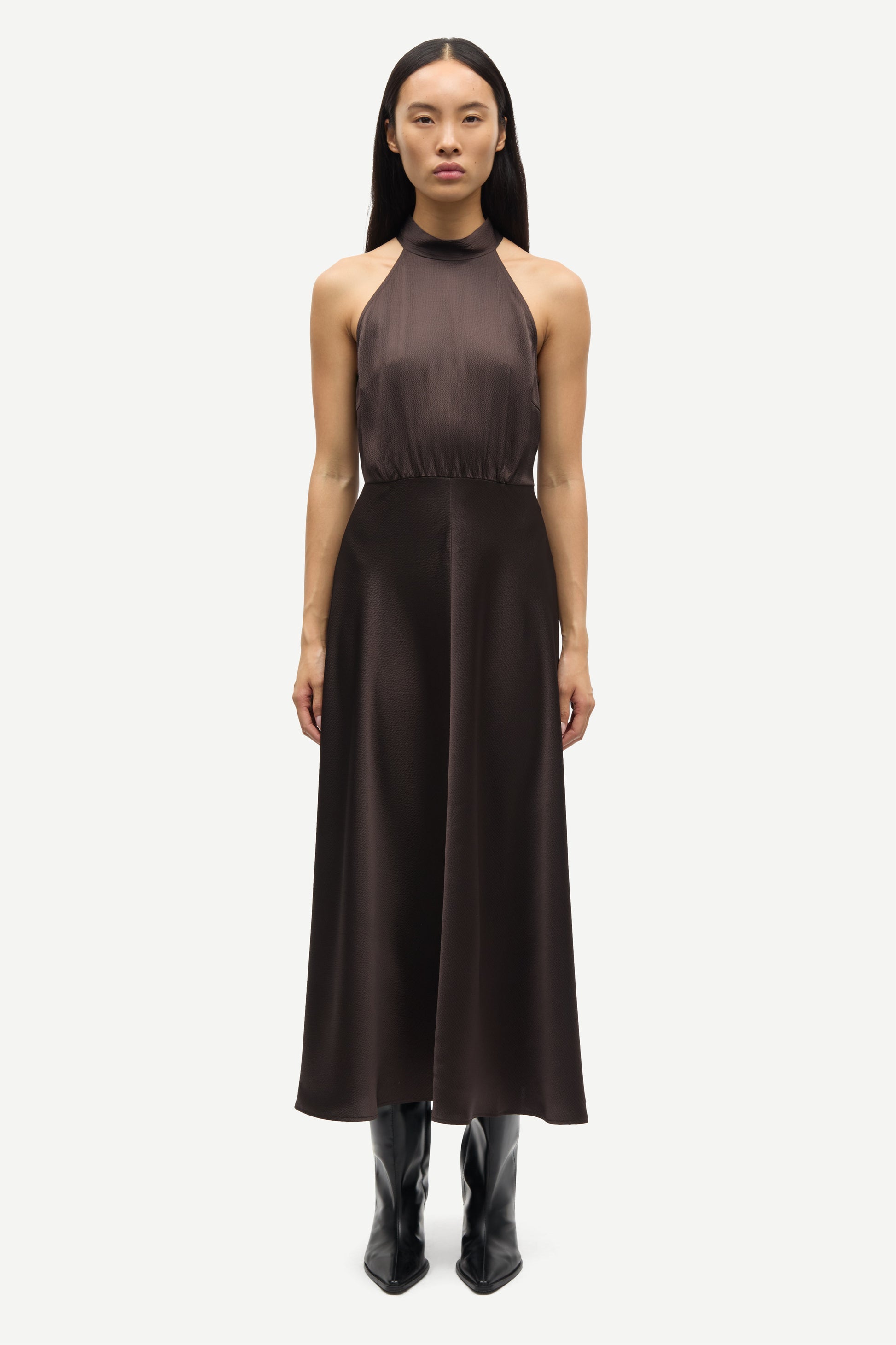 navy blue halterneck dress with open back and tie detail from samsoe samsoe model shot