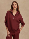 maroon high neck quarter zip jumper with zip detailing and relaxed fit model shot