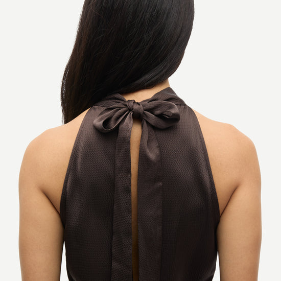 navy blue halterneck dress with open back and tie detail from samsoe samsoe close up of rear 