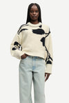 round neck cream cotton jumper with black floral print and ribbed hem, cuffs and neck from samsoe model shot