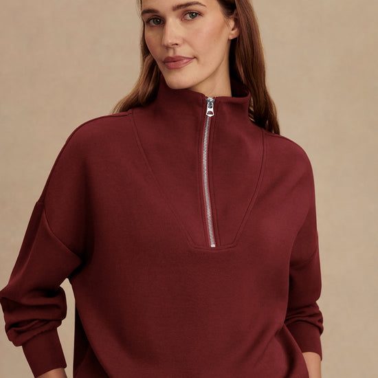 maroon high neck quarter zip jumper with zip detailing and relaxed fit model shot